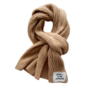 Minimalist khaki knitted scarf with thick cable knit texture and retro fashion label