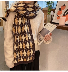 Detail of vintage argyle knit scarf in brown and cream, thick winter pashmina wrap