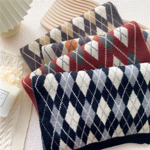 Classic argyle knit scarf in navy, burgundy and brown colors for winter warmth