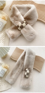 Detail of faux fur winter scarf featuring a brown checkered knit loop fastener