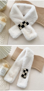 Close-up of white faux rabbit fur scarf featuring a black and white checkered knit loop