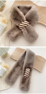 Detail view of taupe faux rabbit fur scarf with striped loop for secure styling