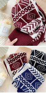 Detail of Nordic geometric knit scarf with soft ribbed edges in red, blue, and black