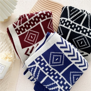 Chunky knit double-sided scarf with geometric patterns in burgundy and navy colors