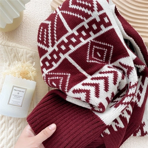 Double-sided knitted red and cream scarf with Nordic geometric patterns for winter warmth
