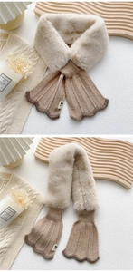 Detail of knit and plush faux fur crossover scarf with elegant scalloped wavy edges