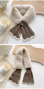Detail of cross-knot plush scarf showing beige faux fur and dark brown knitted texture