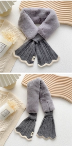 Detail of gray plush fur and ribbed knit scarf with elegant scalloped trim and logo