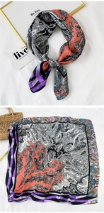 Detail view of patterned silk square scarf featuring orange paisley and purple stripes