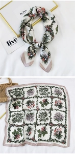 Detailed view of square vintage floral silk scarf with satin finish and rustic pattern