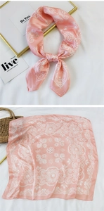 Pink paisley square silk scarf with elegant floral patterns and a smooth satin texture