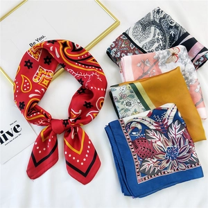 Elegant assortment of printed silk scarves featuring bohemian and floral patterns
