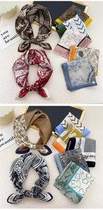 Detailed view of assorted silk-feel square scarves with artistic floral and geometric patterns