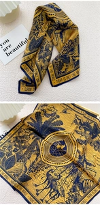 Detail of silk scarf texture with tropical palm leaves and vintage crane print