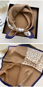Detail of a vintage floral silk square scarf with patchwork design in a luxury gift box