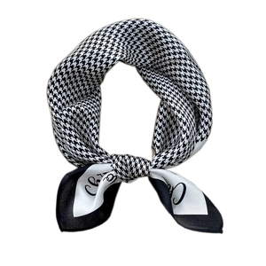 Elegant houndstooth silk scarf with black and white artistic lettering and bow knot