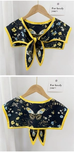 Detail of vintage butterfly print scarf shawl with yellow trim and tie closure