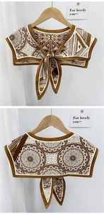 Detailed view of vintage geometric print shawl collar with decorative bow fastening