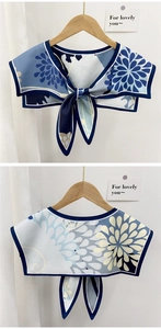 Detailed front and back view of a floral navy blue decorative shawl collar with tie-fastening