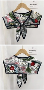 Detail of creative illustration print shawl scarf with bow tie and black contrast piping