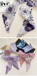 Close-up of lightweight printed skinny scarves with floral and geometric patterns