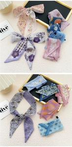 Detail of floral chiffon skinny scarves used as hair ties and handbag decorations