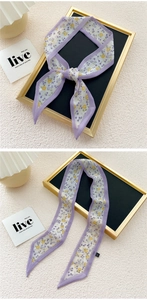 Detail of floral skinny scarf showing purple floral print and delicate rolled edge finish