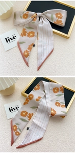Bloemenprint haarsjaal in crème met oranje bloemen en stippen als strik