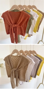 Detailed close-up of diamond hollow-out crochet knit shawls with tie-up design