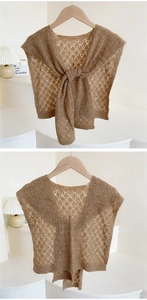 Detail of brown hollow-out knit shawl featuring vintage diamond crochet and neck tie-up