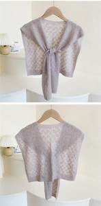 Detail of lavender crochet knit shawl with intricate diamond patterns and front tie design