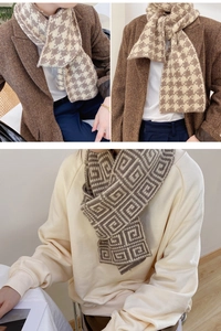 Detailed close-up of double-sided houndstooth and geometric pattern knitted winter scarf