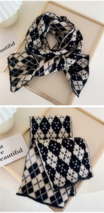 Close-up of black and white geometric knit pattern on thick warm winter scarf