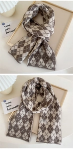 Close-up of retro brown and beige argyle knit scarf with soft cashmere texture