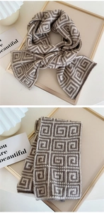 Macro detail of geometric pattern on thick knitted scarf with warm earthy tones