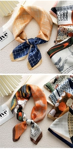 Detail of silk square scarf featuring vintage carriage prints and rolled edge finish