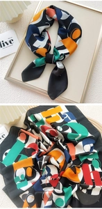 Macro detail of colorful silk scarf with geometric patterns and artistic prints