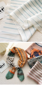 Detailed view of 70x70 satin silk scarves featuring striped and floral print patterns