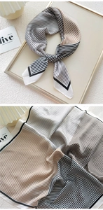 Detailed macro view of striped silk scarf texture and elegant knotted styling features