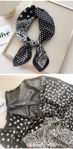 Detail of 70x70 black and white silk scarf with paisley and polka dot patterns
