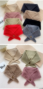 Detailed close-up of thick basket weave knit neck warmer with decorative button detail