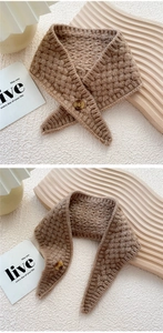 Close-up detail of the brown knit texture and button closure on this warm winter scarf