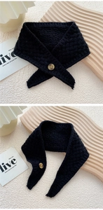 Detail of black wave knit neck warmer with amber texture button closure for women