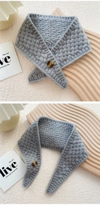 Detail of grey knitted scarf showing honeycomb texture and brown wooden button closure