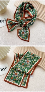Close-up of floral skinny silk scarf with green flower pattern and brown border