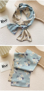 Detail of light blue daisy floral print silk neck scarf for women with elegant drape