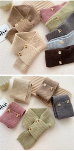 Detailed knit texture and vintage buttons of a cozy striped button-up cross neck warmer