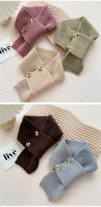 Close-up of ribbed knit scarves with marble texture buttons in five pastel colors