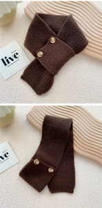 Detail of coffee brown knit scarf featuring vertical stripes and two marble effect buttons