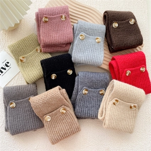 Knitted crossover scarf with buttons in various colors for cozy winter warmth